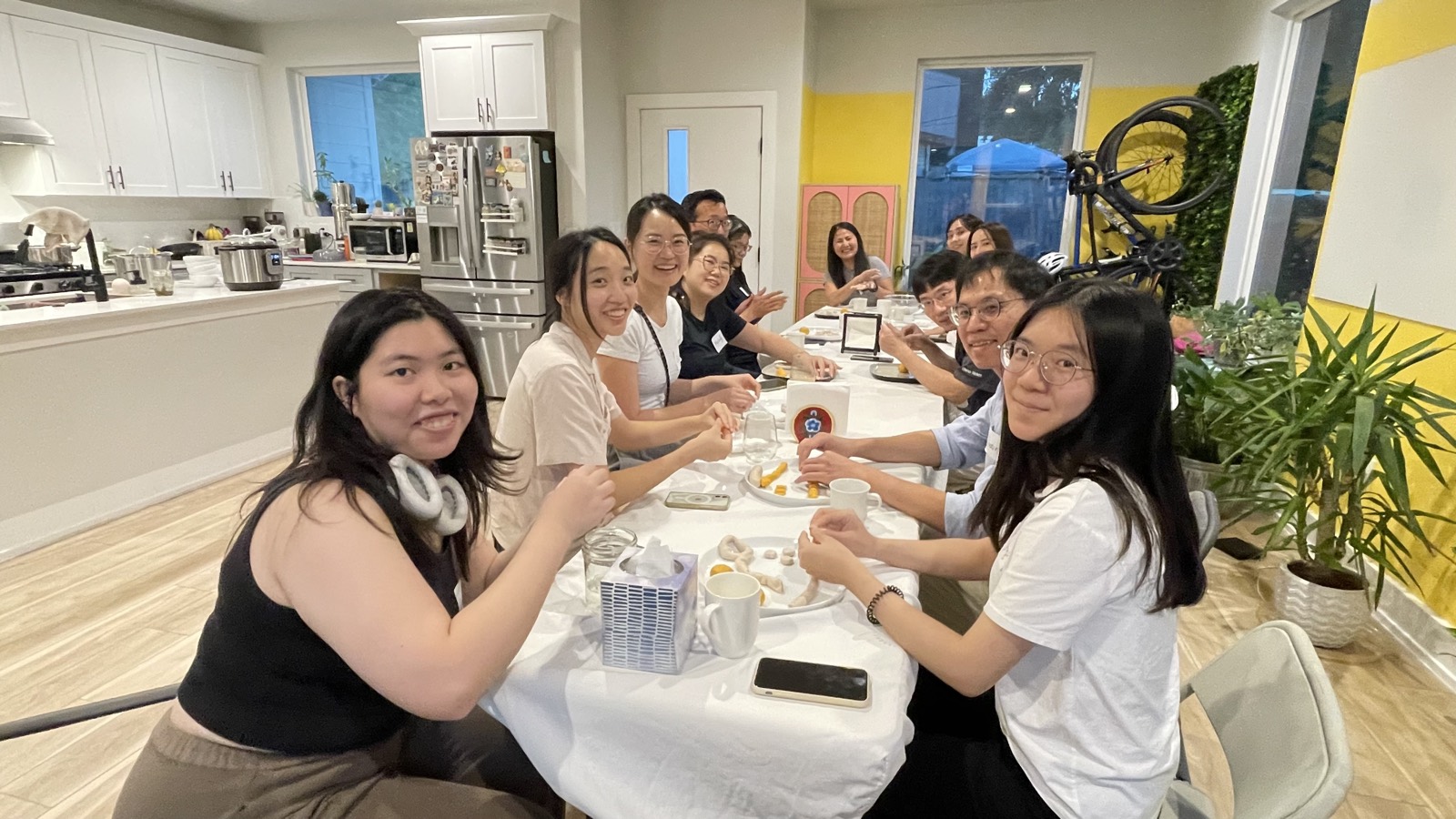 A long table of Amorai Collective members gathered for Taiwan Night, making tapioca taro balls together.